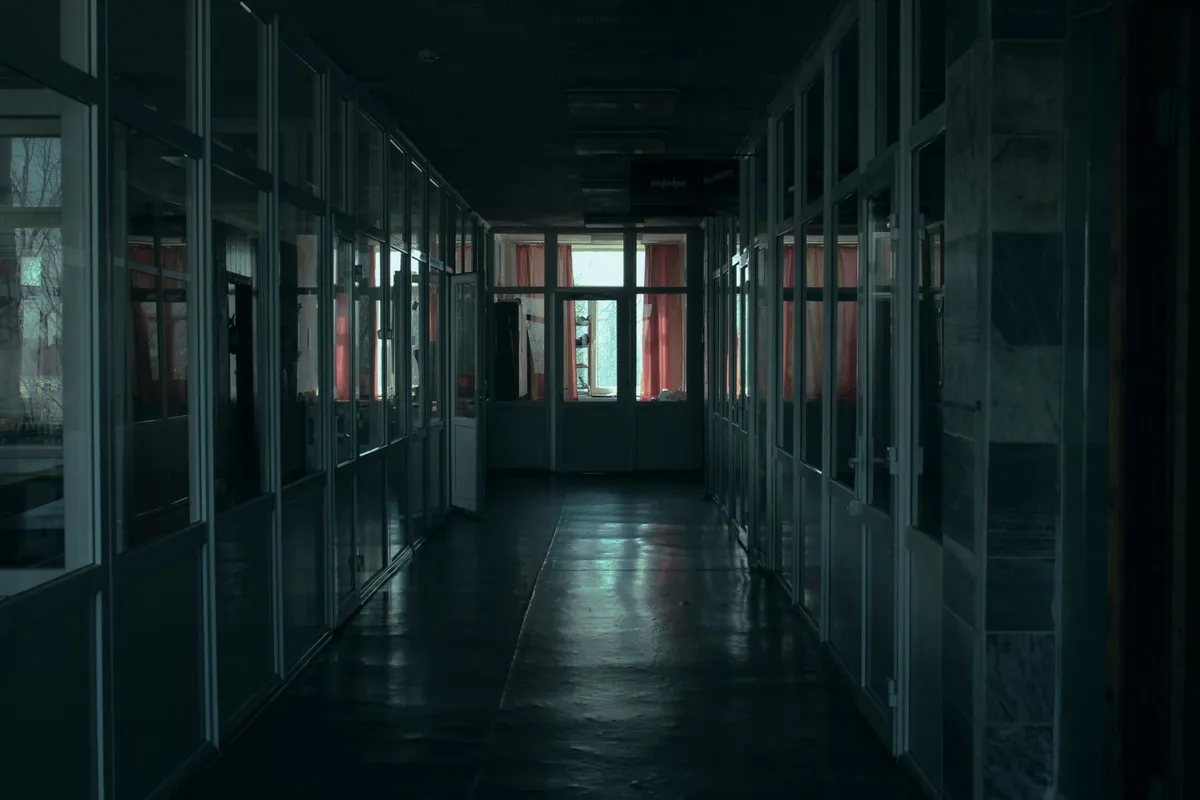 A closed door with light underneath, the one thing a lying husband is protecting