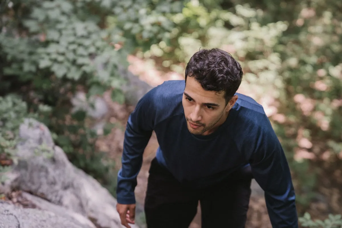 A man walking uphill on a path in the morning after a porn relapse