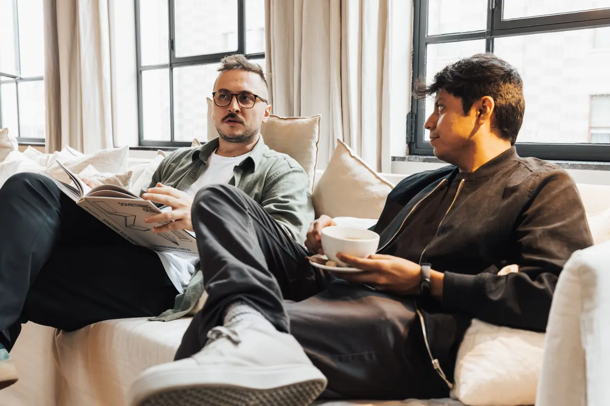 Two men in a serious conversation, the kind of direct support that helps in a midlife crisis